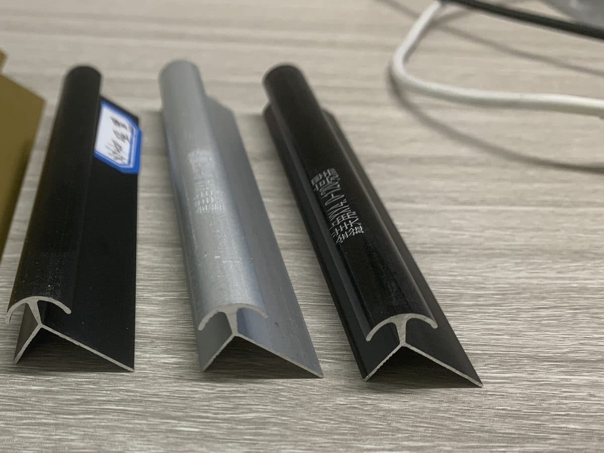 Wall panel external corner trim profiles, black and silver