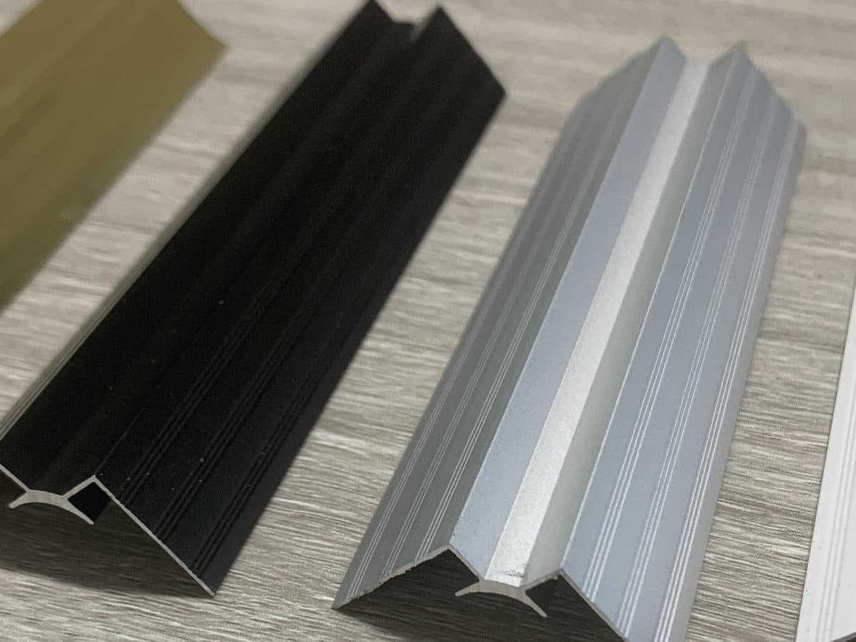 Wall panel internal corner trim profiles, black and silver